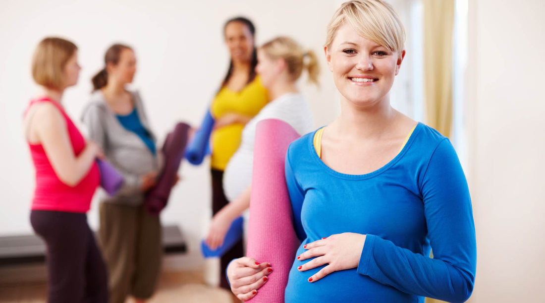 Pregnant women at yoga class